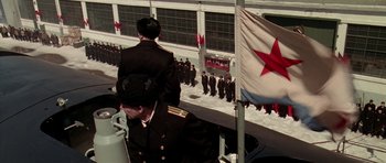 Movie still from “K-19: The Widowmaker” (2002), directed by Kathryn Bigelow – A group of people standing next to each other on top of a building; Wide shot, Low angle