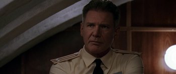 Movie still from “K-19: The Widowmaker” (2002), directed by Kathryn Bigelow – A person wearing a shirt and a tie; Close Up shot, Low angle