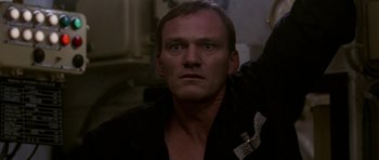 Movie still from “K-19: The Widowmaker” (2002), directed by Kathryn Bigelow – A person wearing a black shirt; Close Up shot, Low angle