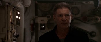 Movie still from “K-19: The Widowmaker” (2002), directed by Kathryn Bigelow – A person wearing a black shirt; Close Up shot, Low angle