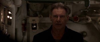 Movie still from “K-19: The Widowmaker” (2002), directed by Kathryn Bigelow – A person wearing a black shirt; Close Up shot, Low angle