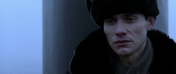 Movie still from “K-19: The Widowmaker” (2002), directed by Kathryn Bigelow – A person wearing a hat; Close Up shot, Low angle