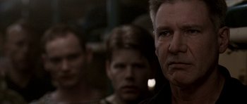 Movie still from “K-19: The Widowmaker” (2002), directed by Kathryn Bigelow – A group of men standing next to each other; Close Up shot, Over the shoulder angle