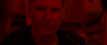 Movie still from “K-19: The Widowmaker” (2002), directed by Kathryn Bigelow – A person wearing a black shirt; Close Up shot, Over the shoulder angle