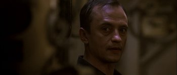 Movie still from “K-19: The Widowmaker” (2002), directed by Kathryn Bigelow – A person wearing a black shirt; Close Up shot, Low angle