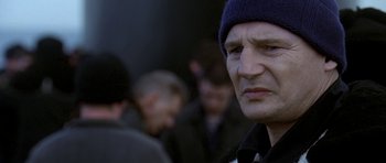 Movie still from “K-19: The Widowmaker” (2002), directed by Kathryn Bigelow – A person wearing a hat; Close Up shot, Over the shoulder angle