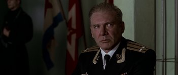 Movie still from “K-19: The Widowmaker” (2002), directed by Kathryn Bigelow – A man in a military uniform is looking at the camera; Close Up shot, Low angle