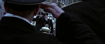 Movie still from “K-19: The Widowmaker” (2002), directed by Kathryn Bigelow – A group of men standing next to each other in uniform; Medium shot, Low angle