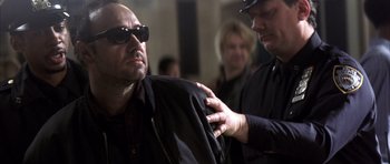 Movie still from “K-PAX” (2001), created by Robert Cochran – A man in a black jacket and a woman in a black jacket; Close Up shot, Over the shoulder angle