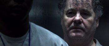 Movie still from “K-PAX” (2001), created by Robert Cochran – A person looking at the camera; Close Up shot, Over the shoulder angle