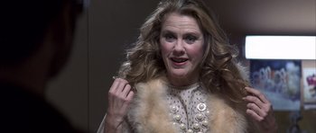 Movie still from “K-PAX” (2001), created by Robert Cochran – A person wearing a fur coat; Close Up shot, Low angle