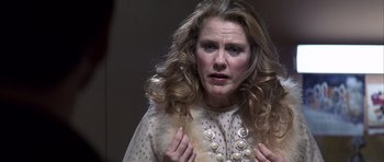 Movie still from “K-PAX” (2001), created by Robert Cochran – A person with long hair; Close Up shot, Low angle