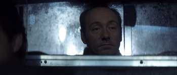 Movie still from “K-PAX” (2001), created by Robert Cochran – A person looking out of a window; Close Up shot, Over the shoulder angle