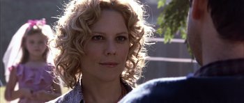 Movie still from “K-PAX” (2001), created by Robert Cochran – A person with curly blonde hair; Close Up shot, Over the shoulder angle