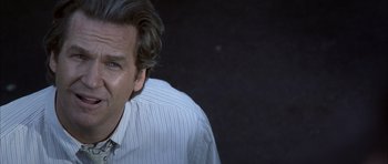 Movie still from “K-PAX” (2001), created by Robert Cochran – A person wearing a dress shirt and tie; Close Up shot, Low angle