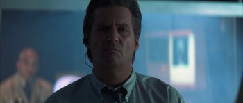 Movie still from “K-PAX” (2001), created by Robert Cochran – A person wearing a headset; Close Up shot, Low angle