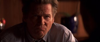 Movie still from “K-PAX” (2001), created by Robert Cochran – A person wearing a dress shirt and tie; Close Up shot, Low angle