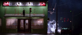 Movie still from “Kalifornia” (1993), directed by Dominic Sena – A street grill restaurant at night with smoke billowing from the building; Extreme Wide shot, Low angle