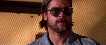 Movie still from “Kalifornia” (1993), directed by Dominic Sena – A person wearing sunglasses; Close Up shot, Low angle