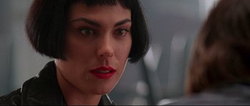 Movie still from “Kalifornia” (1993), directed by Dominic Sena – A person with short black hair; Close Up shot, Low angle