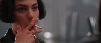 Movie still from “Kalifornia” (1993), directed by Dominic Sena – A person smoking a cigarette; Close Up shot, Over the shoulder angle