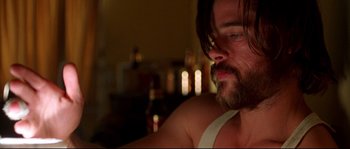 Movie still from “Kalifornia” (1993), directed by Dominic Sena – A person with a beard; Close Up shot, Low angle