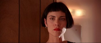 Movie still from “Kalifornia” (1993), directed by Dominic Sena – A person with short black hair; Close Up shot, Low angle