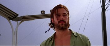 Movie still from “Kalifornia” (1993), directed by Dominic Sena – A person with long hair and a beard; Close Up shot, Low angle