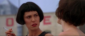 Movie still from “Kalifornia” (1993), directed by Dominic Sena – A woman that is talking to another woman; Close Up shot, Over the shoulder angle