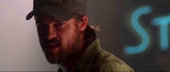 Movie still from “Kalifornia” (1993), directed by Dominic Sena – A person wearing a hat; Close Up shot, Low angle