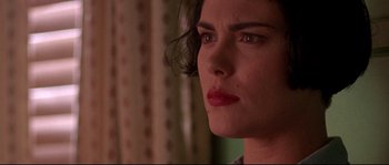 Movie still from “Kalifornia” (1993), directed by Dominic Sena – A close up picture of a woman; Close Up shot, Over the shoulder angle