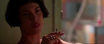 Movie still from “Kalifornia” (1993), directed by Dominic Sena – A person holding a cigarette; Close Up shot, Over the shoulder angle