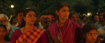 Movie still from “Kantara” (2022), directed by Rishab Shetty – A group of women standing next to each other; Close Up shot, Low angle