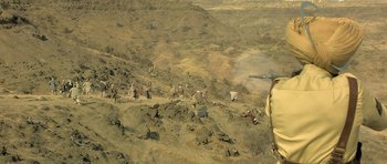 Movie still from “Kesari” (2019), directed by Anurag Singh – An aerial view of a herd of animals on a hill; Extreme Wide shot, High angle