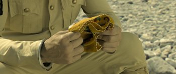 Movie still from “Kesari” (2019), directed by Anurag Singh – A person holding a sandwich in their hands; Extreme Close Up shot, High angle