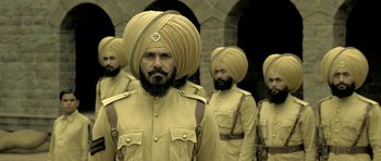 A group of men in military uniforms and turbans