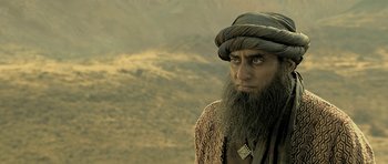 A man with long hair and a long beard