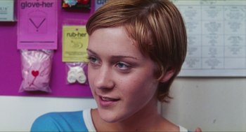 Movie still from “Kids” (1995), directed by Larry Clark – A person with short brown hair; Close Up shot, Over the shoulder angle