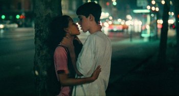 Movie still from “Kids” (1995), directed by Larry Clark – A young man and a young woman are kissing; Medium shot, Overhead angle