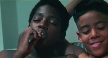 Movie still from “Kids” (1995), directed by Larry Clark – A young man is putting a tooth brush in his mouth; Close Up shot, Low angle