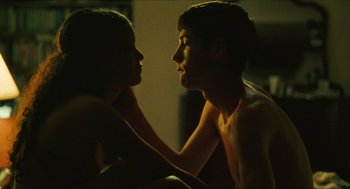 Movie still from “Kids” (1995), directed by Larry Clark – A man and a woman touching each other's chest; Medium shot, Over the shoulder angle