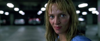 Movie still from “Kill Bill: Vol. 1” (2003), directed by Quentin Tarantino – A person with wet hair; Close Up shot, Low angle