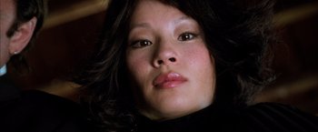 Movie still from “Kill Bill: Vol. 1” (2003), directed by Quentin Tarantino – A woman's face in the dark; Close Up shot, Low angle