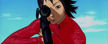 Movie still from “Kill Bill: Vol. 1” (2003), directed by Quentin Tarantino – A woman in a red jacket is holding a rifle; Extreme Close Up shot, Low angle