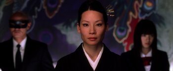 Movie still from “Kill Bill: Vol. 1” (2003), directed by Quentin Tarantino – A woman in a black kimono with a gold hairpiece; Close Up shot, Low angle