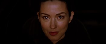 Movie still from “Kill Bill: Vol. 1” (2003), directed by Quentin Tarantino – A woman's face in the dark; Close Up shot, Over the shoulder angle