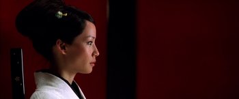 Movie still from “Kill Bill: Vol. 1” (2003), directed by Quentin Tarantino – A person with short black hair; Close Up shot, Over the shoulder angle