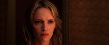 Movie still from “Kill Bill: Vol. 1” (2003), directed by Quentin Tarantino – A person with long hair; Close Up shot, Over the shoulder angle