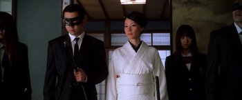 Movie still from “Kill Bill: Vol. 1” (2003), directed by Quentin Tarantino – A man and a woman dressed in a kimono; Medium shot, Low angle
