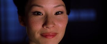 Movie still from “Kill Bill: Vol. 1” (2003), directed by Quentin Tarantino – A woman's face with brown eyes; Extreme Close Up shot, Low angle